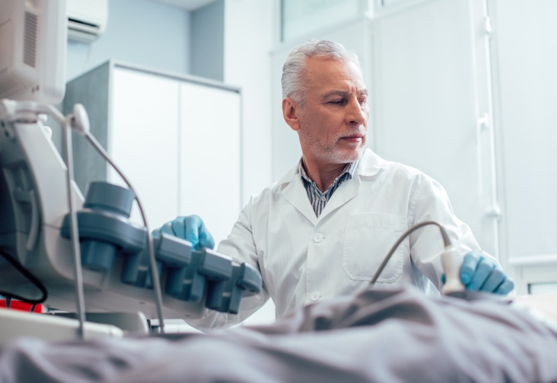 Doctor Examining a Rectal Cancer Diagram for Treatment in Atlanta, GA